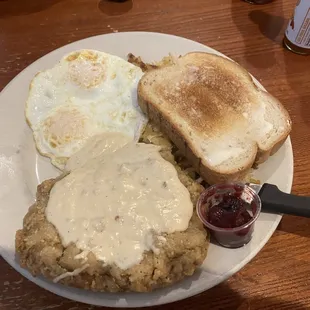 Chicken fried steak with white toast and mixed berry jam!