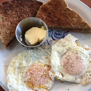 Two eggs over easy with homemade whole wheat multigrain bread