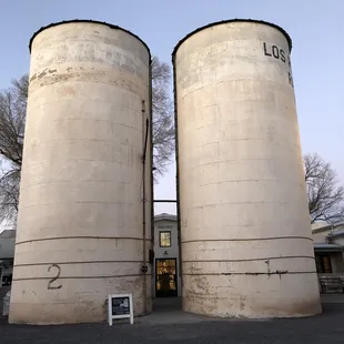 Door to the farm shop just behind the two silos