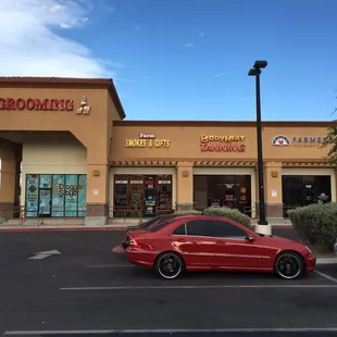 Exterior storefront and its neighbors.