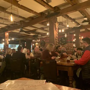 people eating and drinking in a restaurant