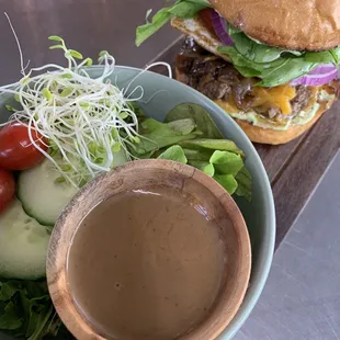 Nela's burger with a side salad
