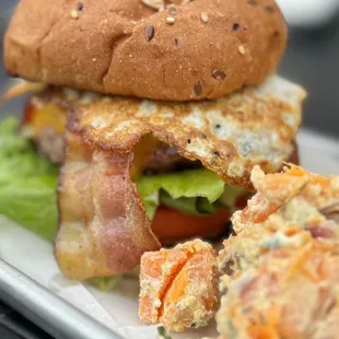 Bacon Hamburger with fried egg on top. Unique sweet potato salad as a side. Everything is so good! Fresh and friendly place.