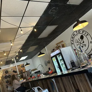 Bar seating and tables and seats in the front and outside.