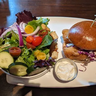 Fish sandwich with side salad
