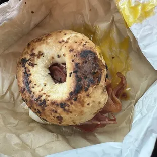 Bacon, dippy egg w/cheese on onion bagel.  standard good food at this farm.