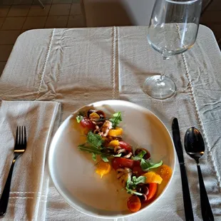 Grilled Octopus appatizer,  peach, citrus and tomatoes