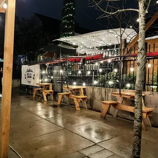 a row of picnic tables and benches