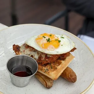 Sunrise over Nashville: rosemary cheddar waffle, Nashville style fried chicken, runny egg, and fingerlings $17