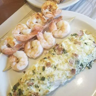 Egg white omnlette with spinach, ham and provolone cheese...and a few shrimp skewers on the side!