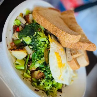 a plate of vegetables and bread