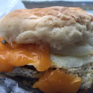 Sausage egg and hoop cheese biscuit with sweet pickles and onions.