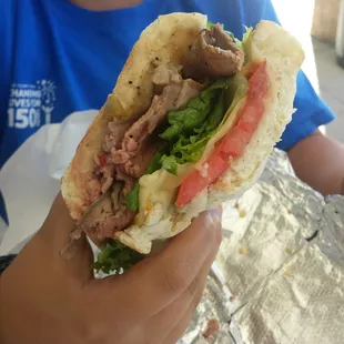 My son destroying the roast beef sandwich.