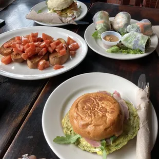 Egg and veggies on biscuit, Vietnamese spring rolls, tomato bruschetta, green eggs and ham on brioche