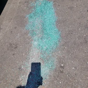 Fresh broken window glass in Farmer Joes parking lot. I was behind a parking car and someone backed into me.