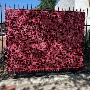  fence covered in red fabric
