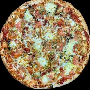 Margherita Pizza -
Sliced Tomato, Fresh Garlic, Fresh Basil, Basil Pesto, Olive Oil, Fresh Pizza Sauce, Grated Parm, Shredded &amp; Fresh Mozz