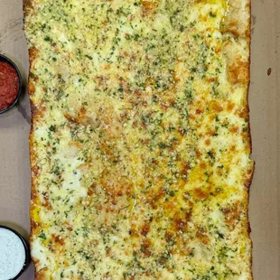 Cheese Bread - 
Detroit Style Deep Dish Bread topped with Garlic Butter,Parmesan Cheese, Mozzarella Cheese and Parsley