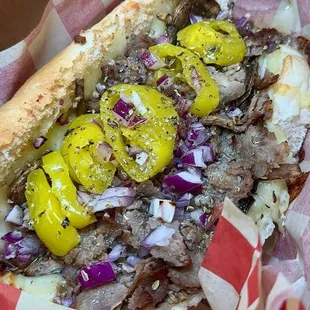 Philly - 
Shaved Ribeye, Mushroom, Grande Mozzarella, Red Onion