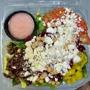 Greek Salad - 
Romaine, Kalamata Olives, Sliced Tomato,
Banana Peppers, Chickpeas, Beets, Feta Cheese and Greek Dressing