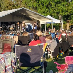 People with chairs for spring concert.