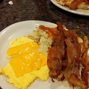 Standard Breakfast with hash browns, scrambled eggs, and bacon