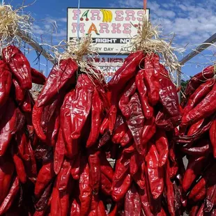 Hatch red chile ristras in front of our old sign