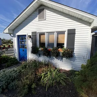a white house with a blue door