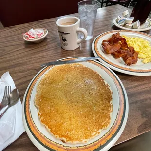 Light and fluffy buttermilk pancakes with bacon and scrambled eggs at the Farmer&apos;s Daughter Cafe!