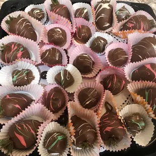 a tray of chocolate covered strawberries