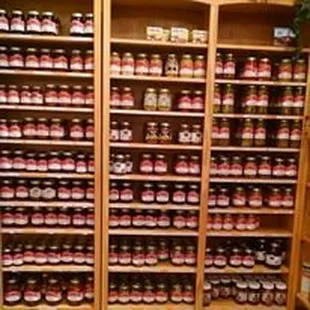 A ton of different jarred goods (jellies, fruits, salsa, pickled veggies)