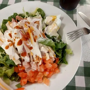 My salad. The red spots are from the hot sauce I added. The Blu-Cheese was a bit more watery than I am used to but flavorful.