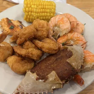 Fried shrimp,boiled shrimp, crabs , salmon and corn
