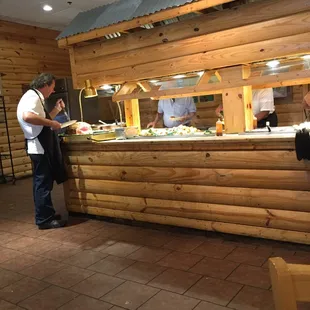 Cutting ham wish I could taste it however been here ten min no wait staff yet to take my drink order so..... Hopefully soon