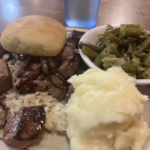 Beef Tips (rare) and rice, mashed potatoes, green beans, &amp; dinner roll $12!