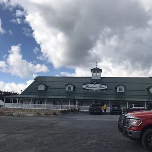 a red truck parked in front of the building