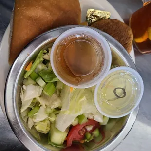 a bowl of salad and a sandwich