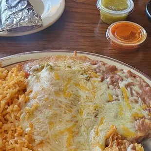 Chicken enchilada, rice, beans.
