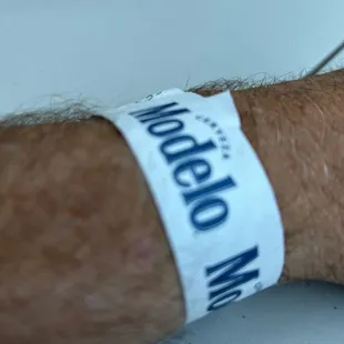a man&apos;s hand with a wristband