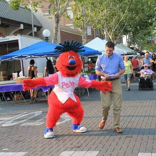 a man dressed as a red bird