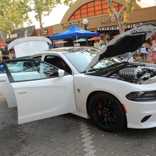 a white car with its hood open