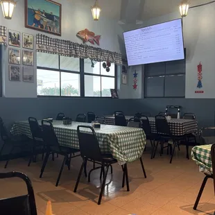 tables and chairs with checkered tablecloths