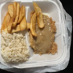 To go (country) fried chicken with rice and French Fries ... I guess country means with gravy?! He ate it up . Great fries