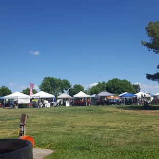a large open field with tents