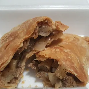 Delicious Beef Pasty, a hand pie made from a homemade pie crust filled with ground beef, potatoes, onions and seasonings
