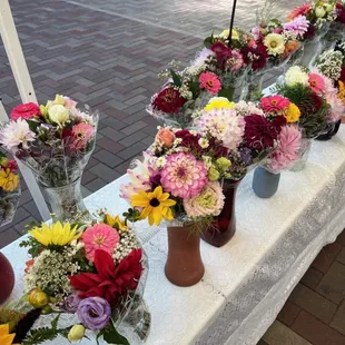 a long table with vases of flowers