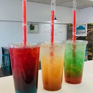 three different colored drinks