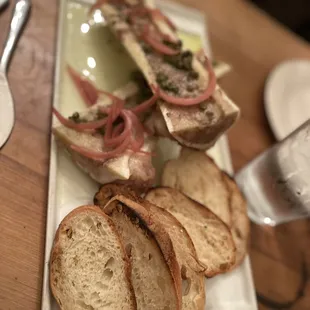 a platter of bread and vegetables