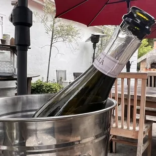 a bottle of wine in a bucket