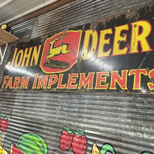 sign for john deere farm implements